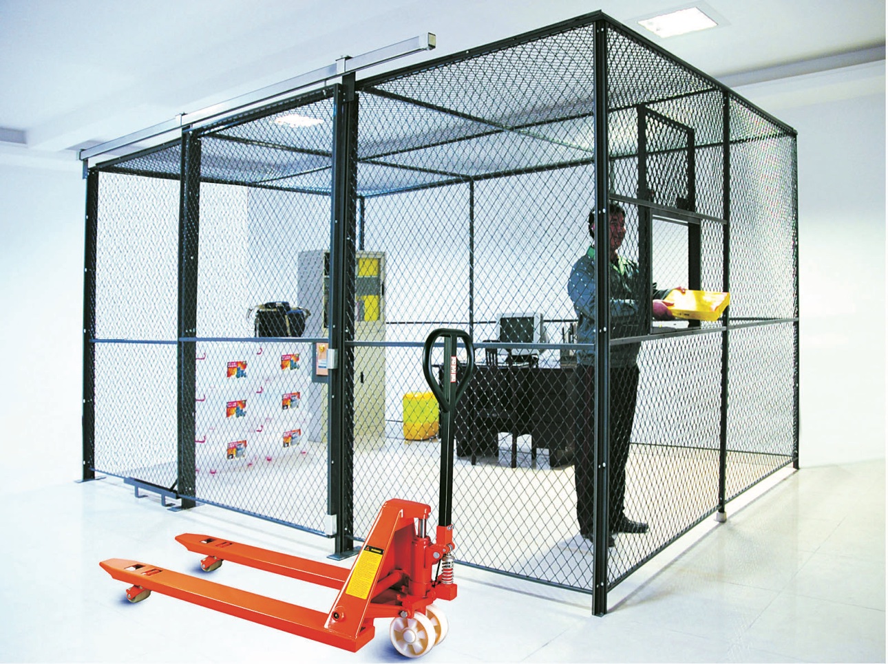 Woven wire mesh security partition cage installed in a warehouse
